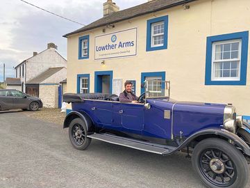 Vintage car in front of the pub