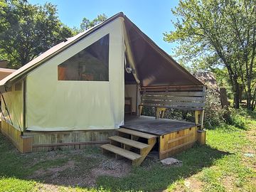 Safari tent on a wooden deck