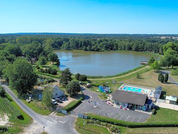 Aerial shot over the site and lake