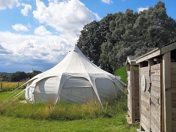 Outside view of tent, shower and toilet cabins