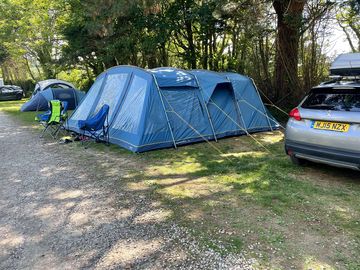 tent pitches by the road