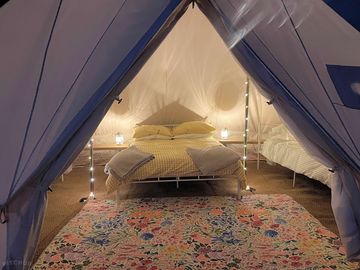 Bell tent interior with double bed