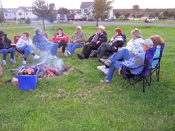 Gathering in the evening around a fire