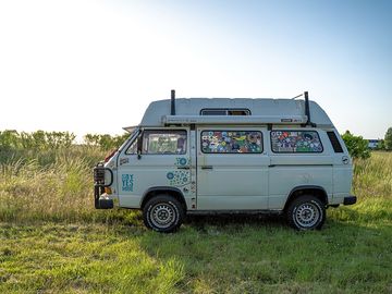 A small campervan parks up in the Big Sky campervan meadow