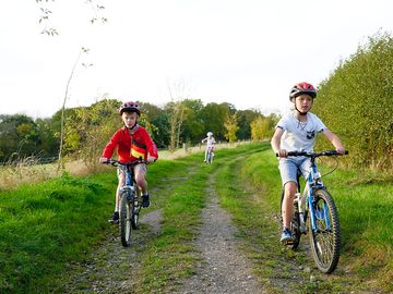 Guests cycling around the site