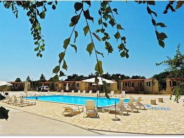 Pool with sun loungers