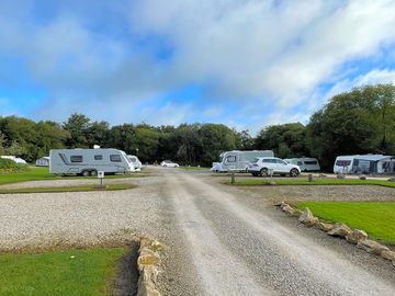 Gravelled pitch and not big enough for car and van.