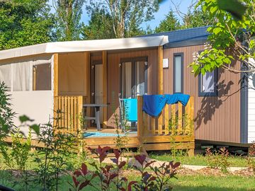 Static caravan in a leafy pitch