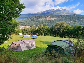 Tent pitches with views of snowy peaks