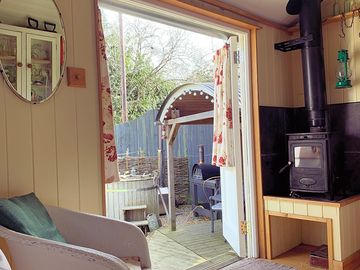 View of the log-fired hot tub from the bed