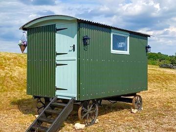 Exterior of Shepherds Hut. Stable doors. Solar lights.