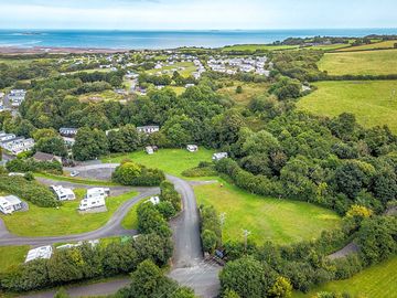 Aerial view of the site with Lligwy Bay in the background