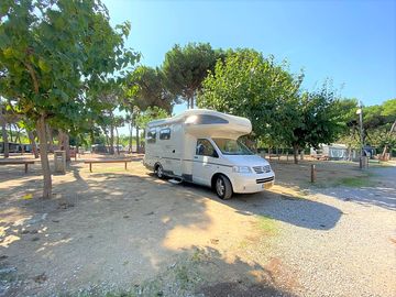 Touring pitch shaded by trees