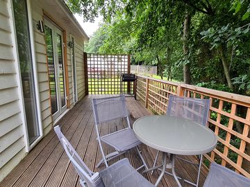 Each lodge has a deck with a barbeque and seating.