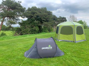 The grass tent pitches