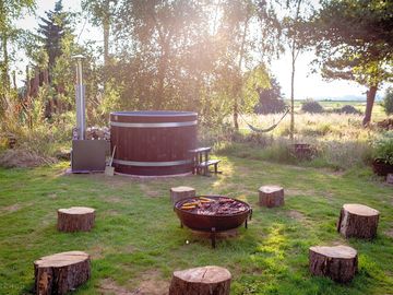 Hot tub and firepit/barbecue for each unit