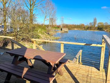 Outdoor eating area on private patio overlooking the main lake