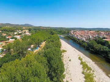 Aerial view of the site and river beach