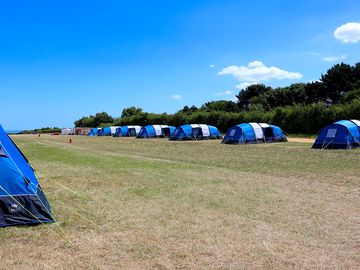Our pre-erected tents give you space to park, bbq, kids to play and have a campfire