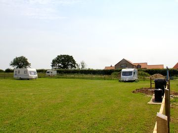Pitches next to waste water, drinking water, general waste and recycling bins