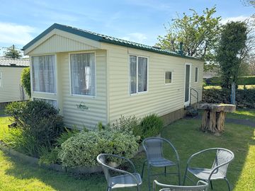 Outside view of 2 bedroom caravan with seating