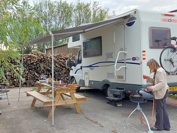 Hardstanding electric hook-up pitch suitable for motorhomes, caravans and long wheeled base vans.