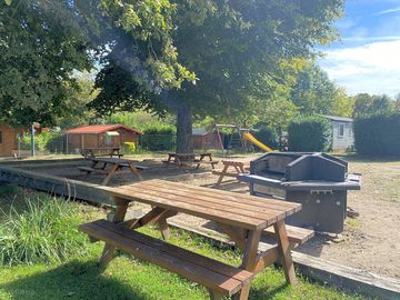 Play area, communal barbecue and seating