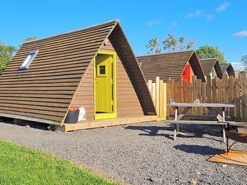 Yellow glamping pod.