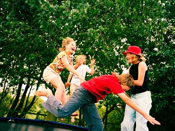 Kids playing on a trampoline
