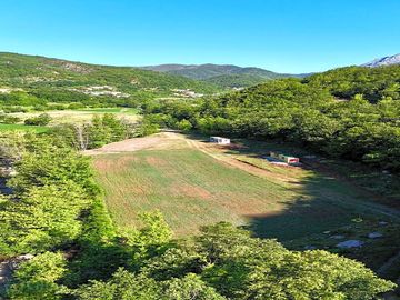Aerial view of the pitches surrounded by greenery