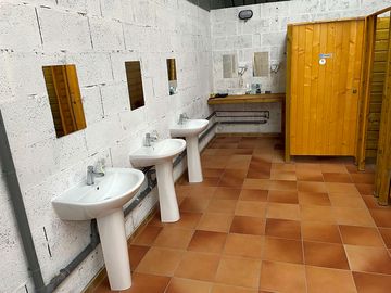 Clean and accessible toilet and shower facilities, including hairdryers