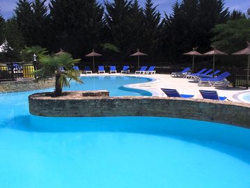 Large swimming pool with hot tub and paddling pool