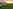 Powered grass travel trailer campsite 