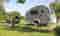 A teardrop trailer on a campsite in France