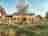 Dorset Nectar Orchard Campsite: The cider garden/sculpture garden with the tasting room, tap room and farm shop behind