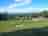Clwydian Holidays: Overview of the site with views of the Clwydian Range (AONB) in the distance