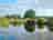 Old Buckenham Country Park: View from the covered outdoor area by the pond and the park