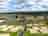 Meadow Springs Country and Leisure Park: Drone view of the touring park and looking towards Arthur's Restaurant & Bar