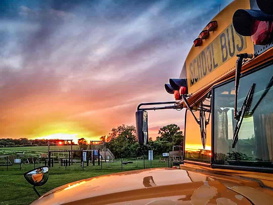 American School Bus Glamping at Petruth Paddocks: Pitched close to the play area
