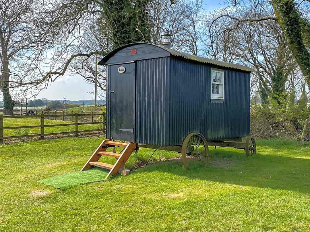 At The Cowshed: Viistor image of the exterior of one of the huts
