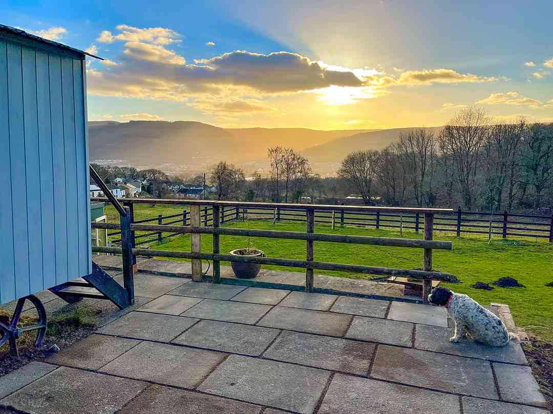Tunnel Glamping: Sunset from the shepherd's hut patio