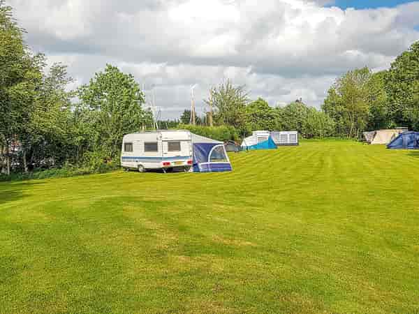 Electric cement/asphalt and grass touring pitch