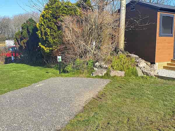 Electric hardstanding and grass campervan pitch (no awning)