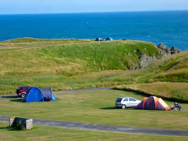 Powered grass tent or trailer tent site