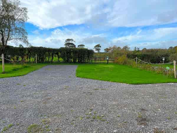 Electric hardstanding and grass touring pitch (maximum 7 metres)