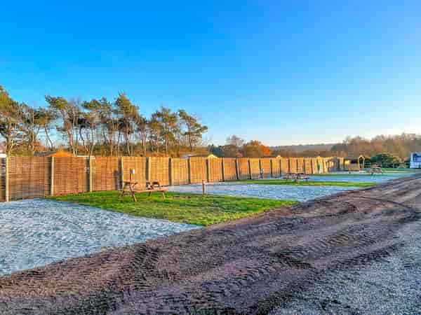 Fully-serviced cement/asphalt and grass touring pitch