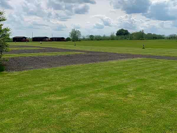 Electric hardstanding and grass touring pitch