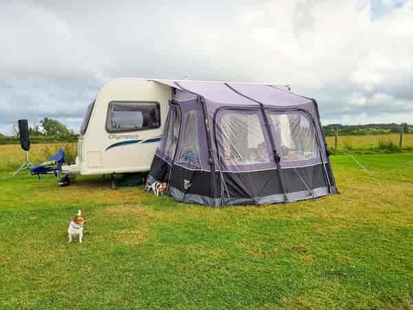 Non-electric hardstanding and grass pitch