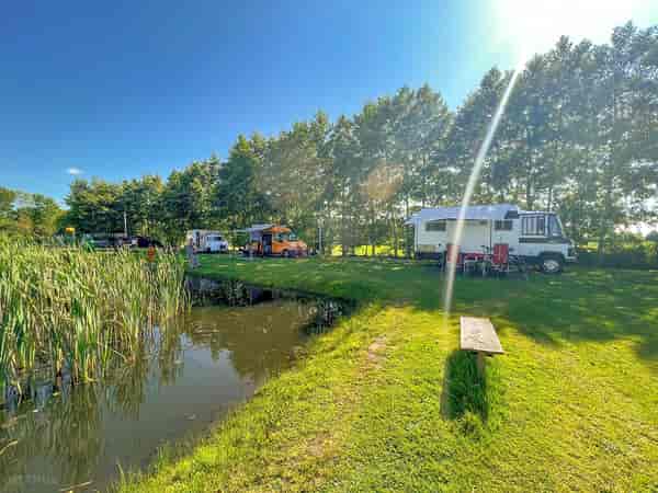 Electric grass and earth touring caravan pitch