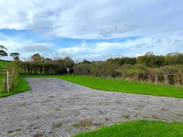 Electric hardstanding and grass touring pitch (maximum 8 metres)
